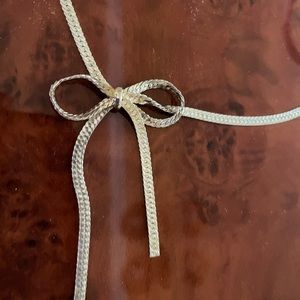 Sterling silver herringbone necklace with bow detail